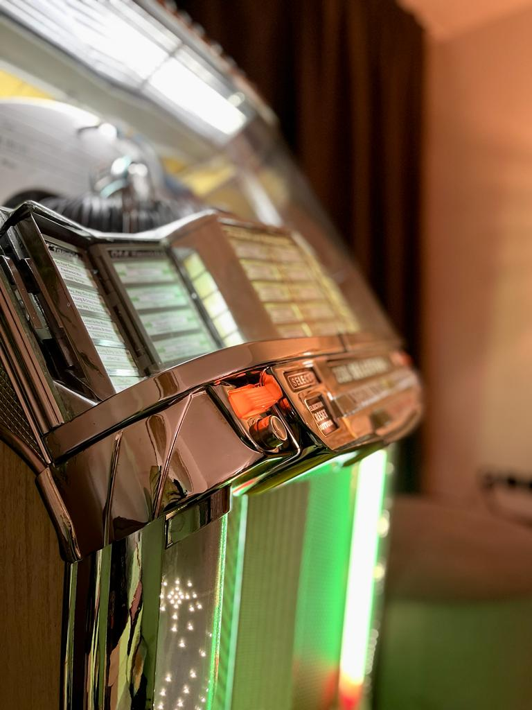 Close-up of Eljee's illuminated vintage jukebox
